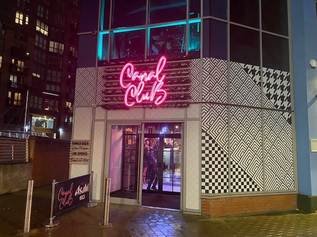 The front of Canal Club with neon signage in Leeds - night