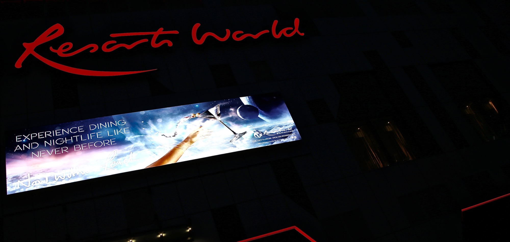 Resorts World hotel digital signage at night