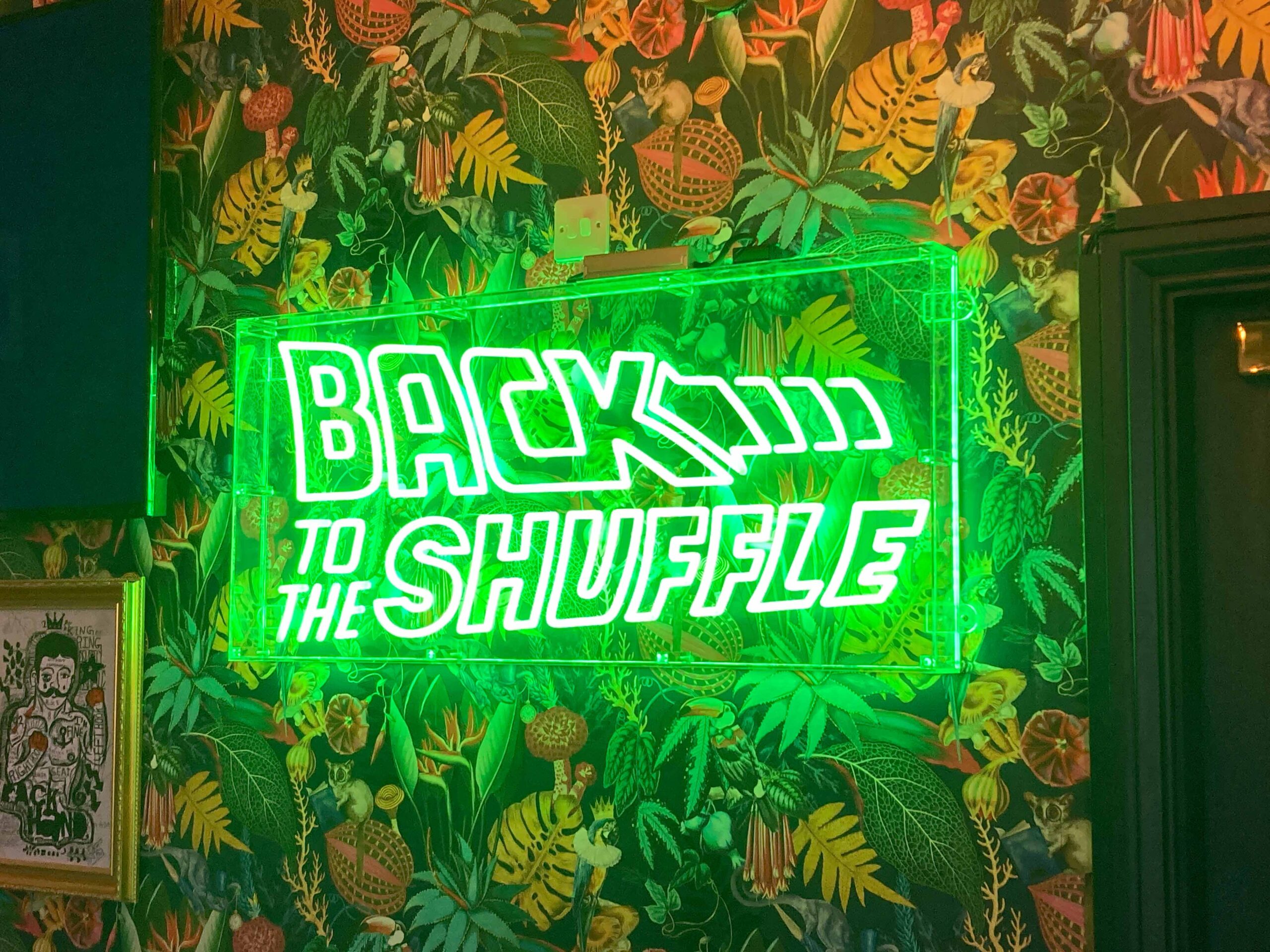 Back to the shuffle - Bright green neon sign