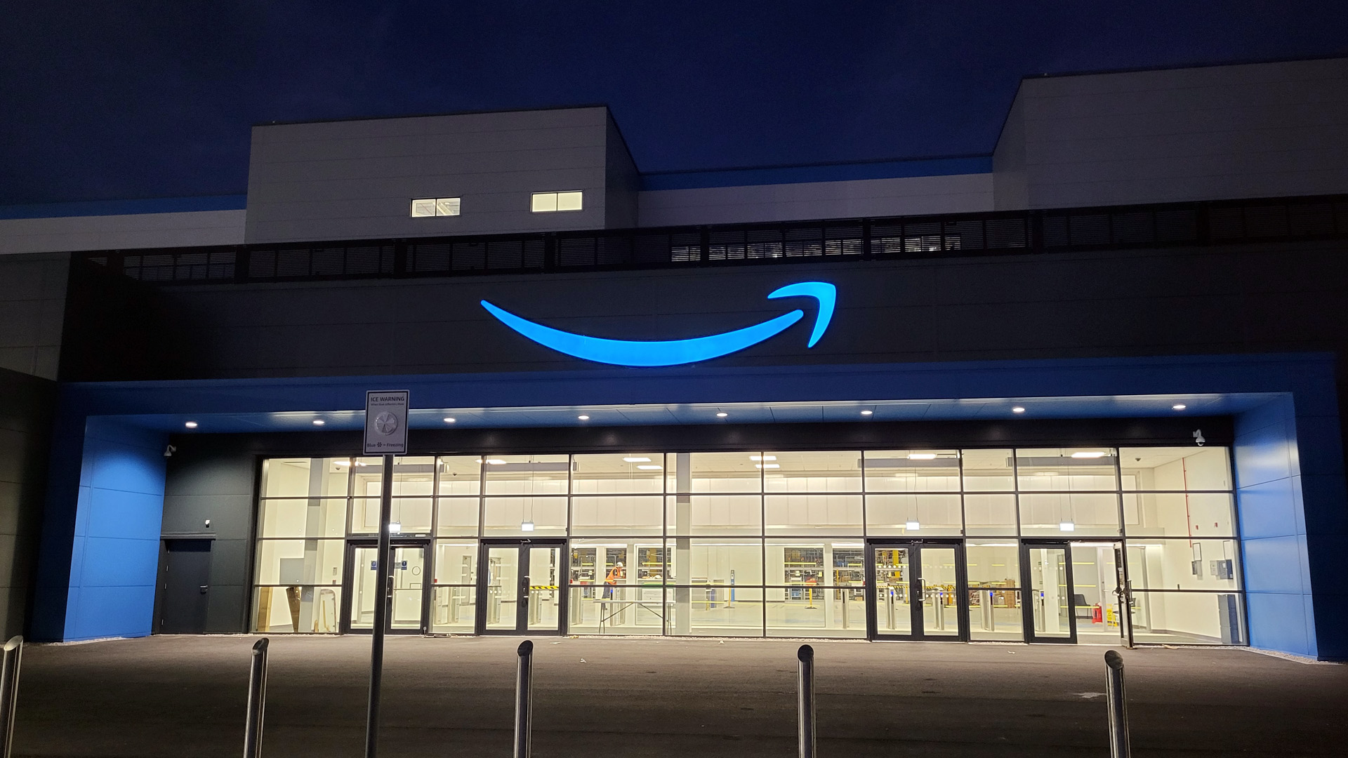 Illuminated Amazon Smile Sign at night